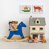 Vilac Wooden Rocking Horse, Tender Leaf Toys Dolls House and Dolls, styled by Bobby Rabbit.